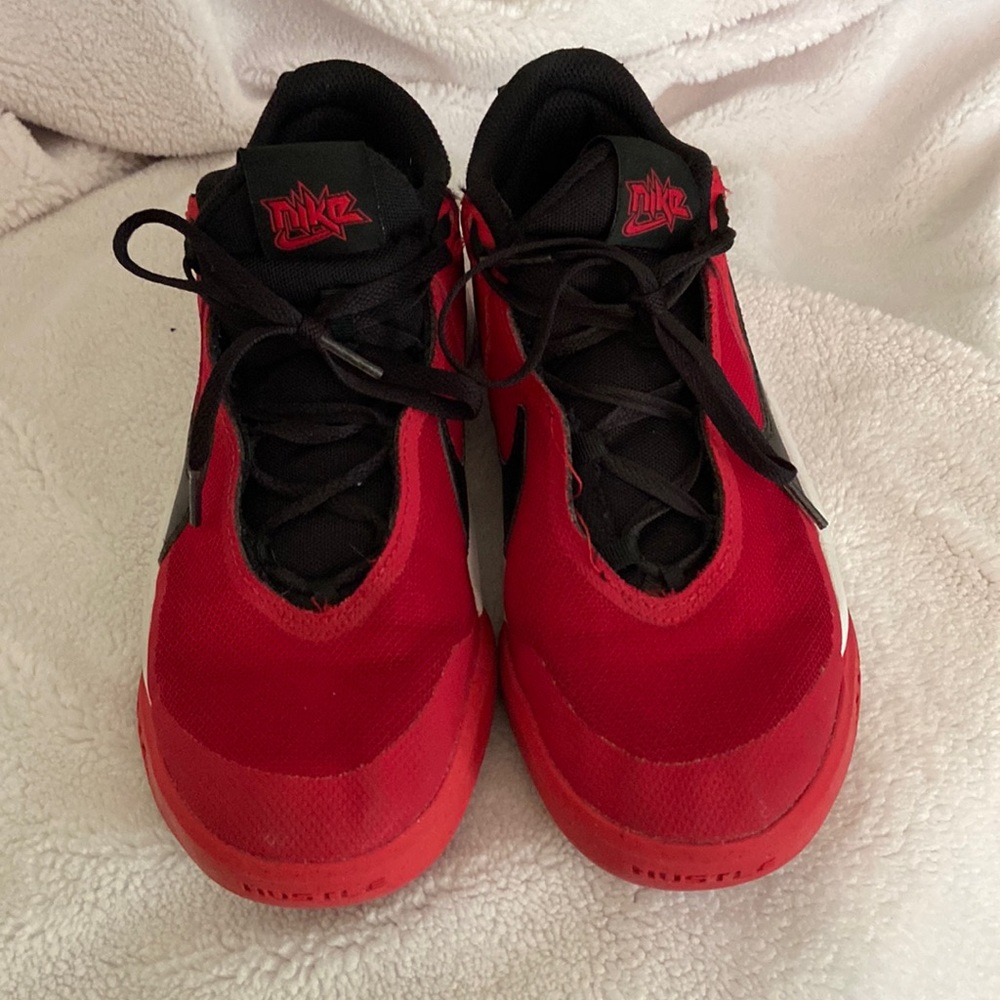 Nike hustle basketball shoes red and black .  boys 5.5 youth